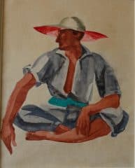 Сидящий мужчина в панаме