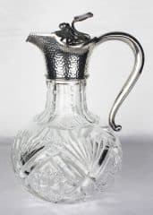 Старинный серебряный кувшин с декором в виде кувшинки