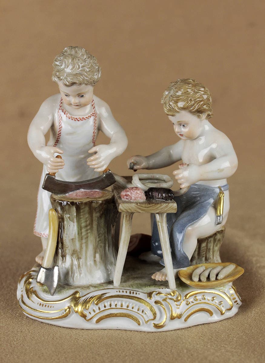 Антикварная фарфоровая статуэтка “В мясной лавке”