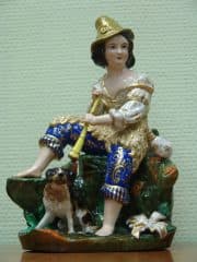 Статуэтка "Пастушок, сидящий с дудочкой в руках"